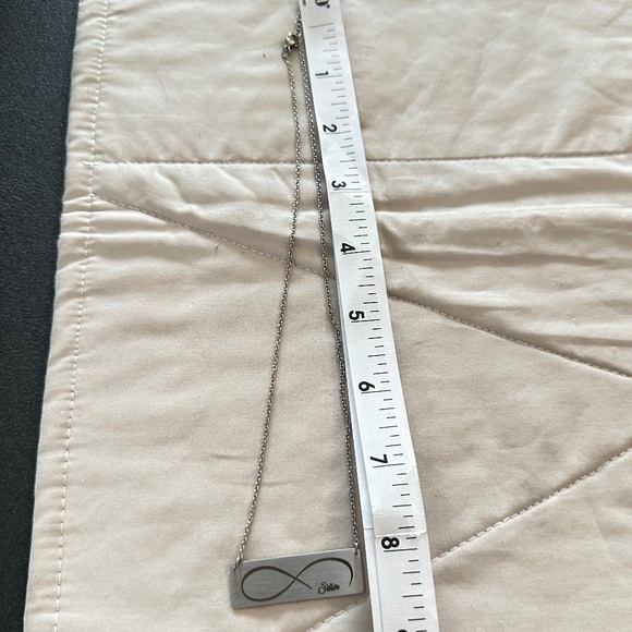 Silver tone rectangular plate on chain w/etched infinity symbol says “Sister” - Picture 7 of 15